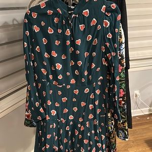 Green flirty dress with red hearts, fit and flare. Side zip.